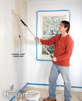 <strong>Step 2:</strong> Roll on the mud -   How to skim coat to get rid of textured walls.