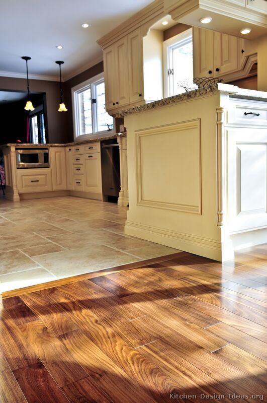 #Kitchen Idea of the Day: Perfectly smooth transition from hardwood flooring to tile floors in an open-plan kitchen.