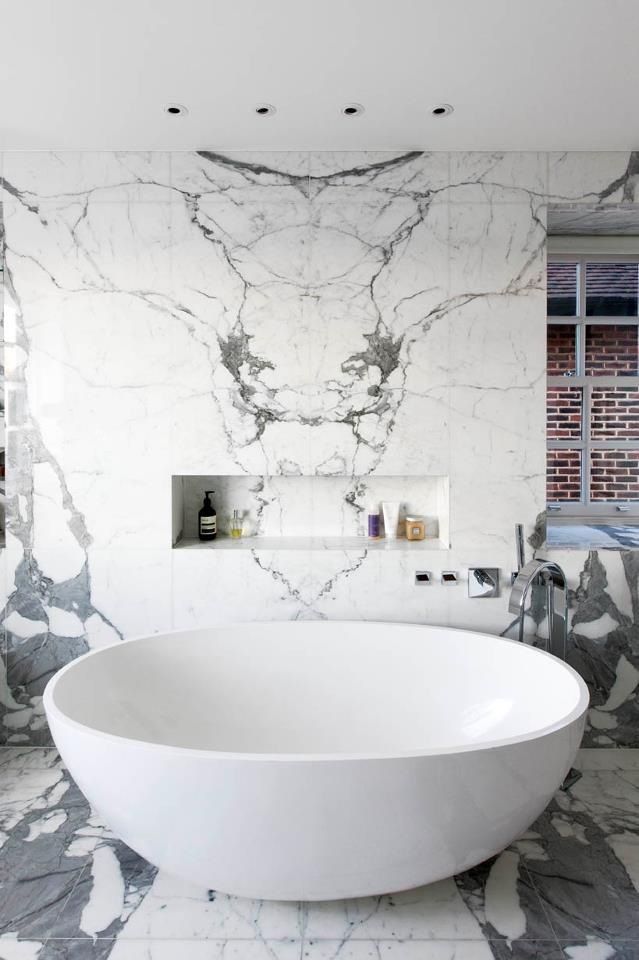 marble bathroom and tub….look at the marble design. Intentional? Looks like a big bird of some kind.