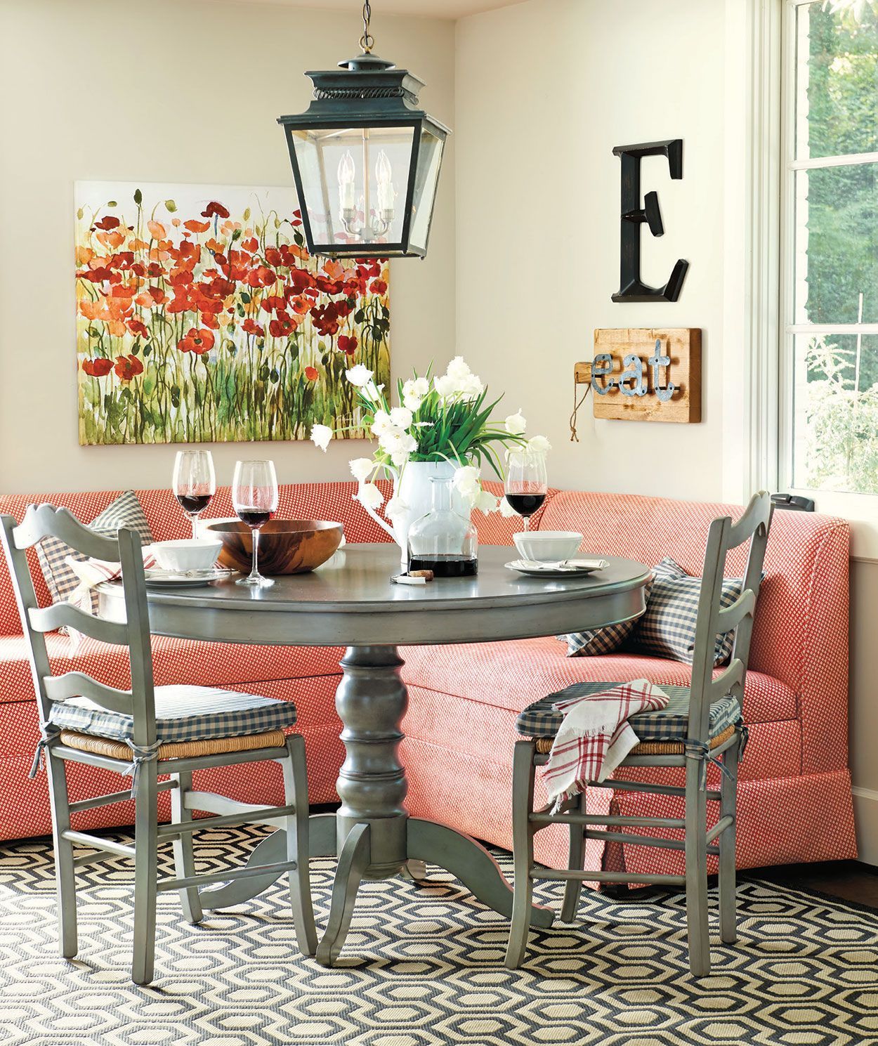 Red banquette seating  I  Click for more dining room inspiration