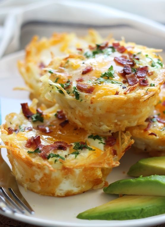 Shredded hash browns and cheese nests baked until crispy topped with a baked eggs, crumbled bacon and more cheese. Served with