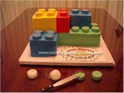 use clear containers (like from tea lights) to fill with icing for the tops of a lego cake.