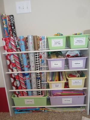 DIY gift wrap station repurposed from an old toy organizer, plus more gift wrap organization ideas {featured on Home Storage