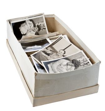 From Shoebox to Album: Organizing a Lifetime of Photos  My grandmother lost all her pre-1950s photos in a flood.     @A Lifetime