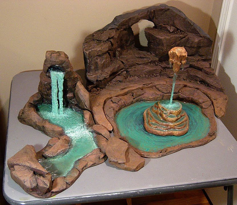 How to make rock caves and waterfalls using pink Styrofoam and hot glue!