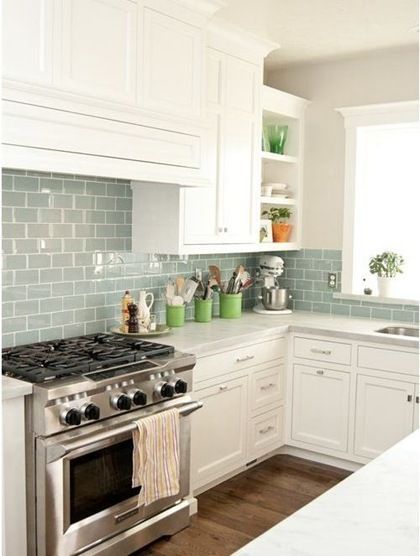 love the color of the subway tile with the white cabinets. May need to do this in my kitchen!