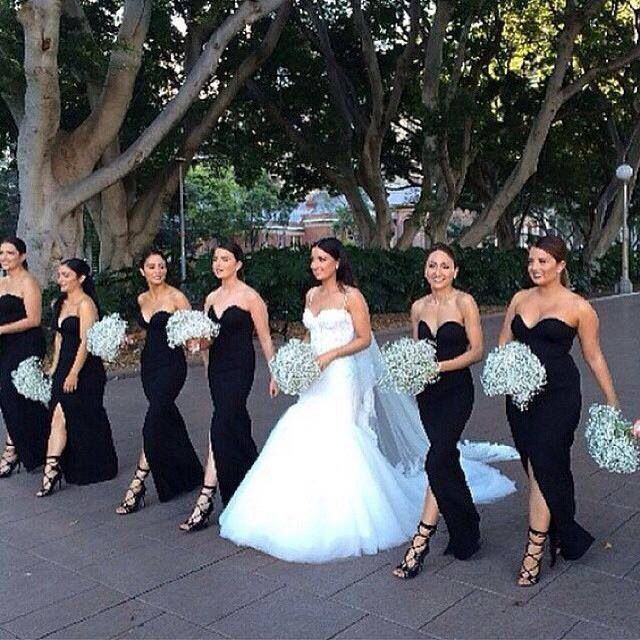 Sweetheart black bridesmaid dresses with baby breath bouquet and bride