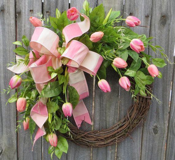This spring wreath is characterized by the most life-like tulips we have ever seen! We actually stored these tulips in a bucket in