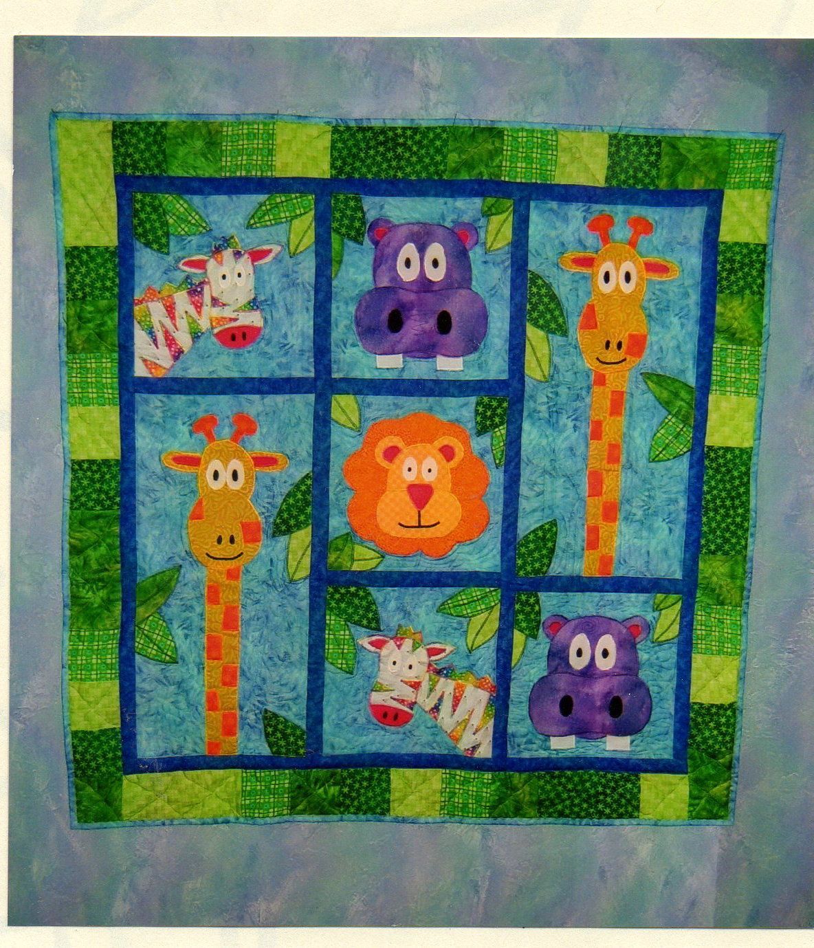 cute baby quilts to make | Cute jungle animals smile across this adorable baby quilt. Children …