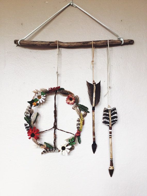 The Bohochic Wildflowers + Feathers Wooden Peace Sign Wreath + Handmade Arrows is the perfect rustic, earthy wall piece OR door