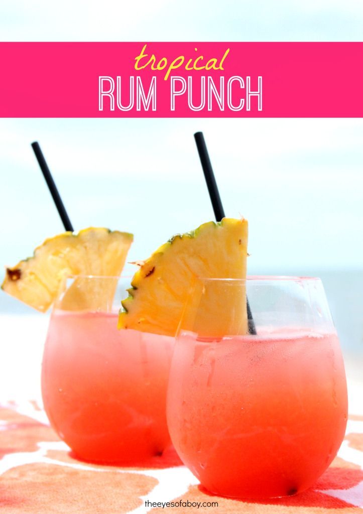 Tropical Rum Punch drink recipe – perfect for Summer weekends! 1 part Mango Rum, 1 part Red Rum, 1.5 ounces cranberry juice, 1.5