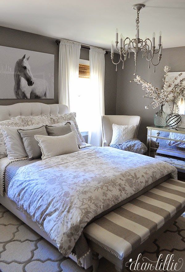 Unexpected artwork like this oversized horse photograph from @HomeGoods adds a bold touch to this monochromatic gray bedroom.