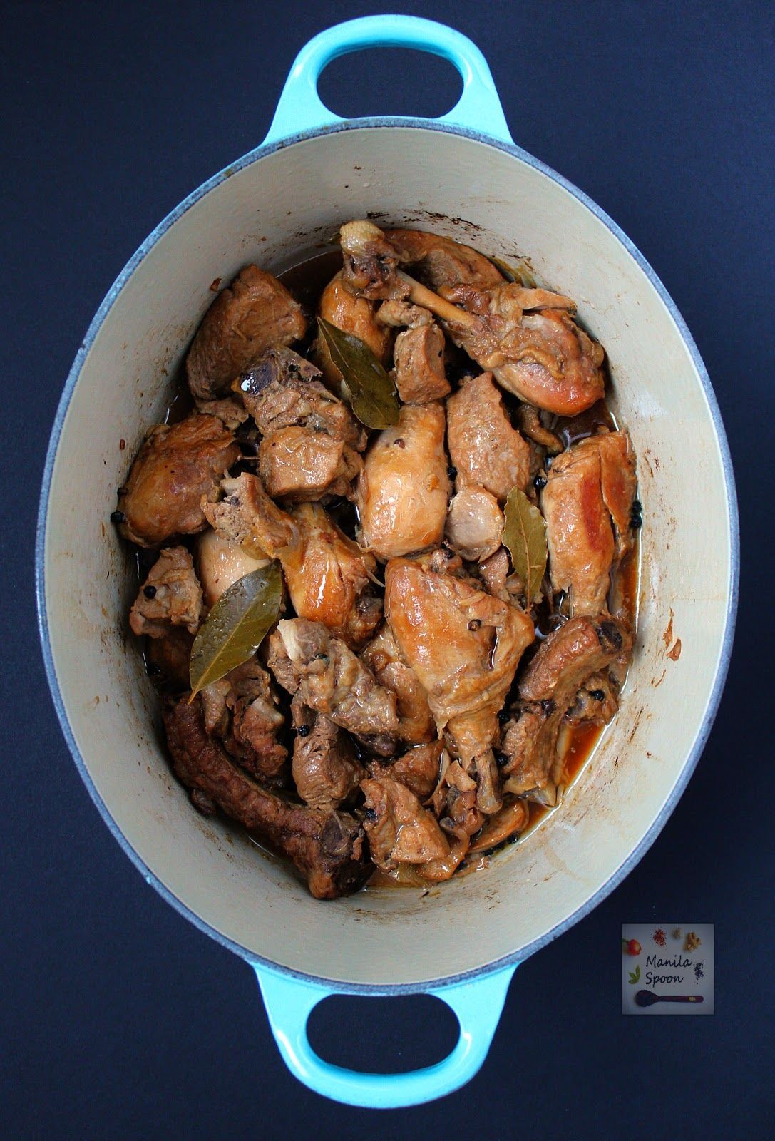 Chicken slowly braised in vinegar, soy sauce, garlic and bay leaves until fall-off-the-bone tender and DEL