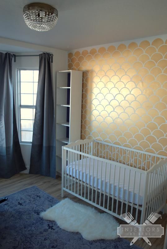 Love this nursery!  The stenciled wall and bookcases are adorable!