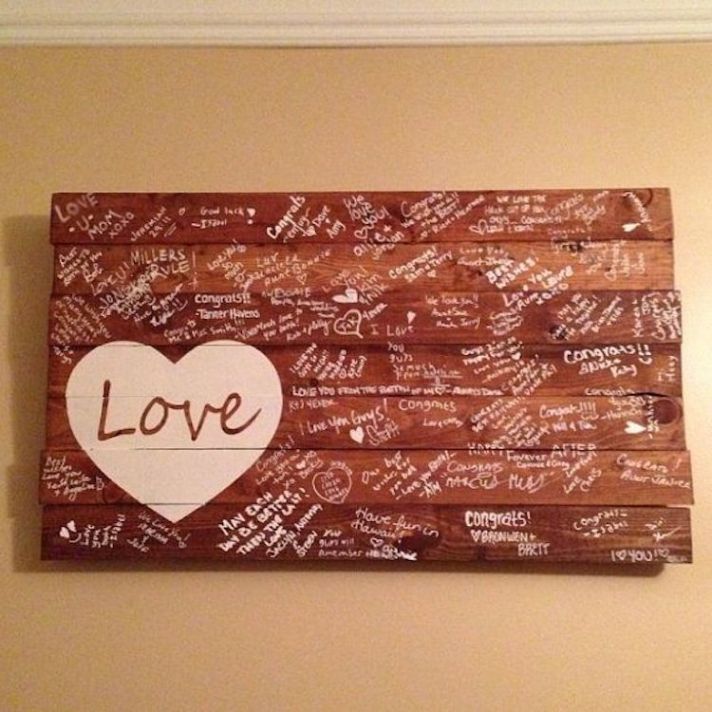 Paint a rustic slab of wood as a guest book alternative!