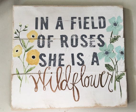 She is a Wildflower wood sign by HelloShoppe on Etsy