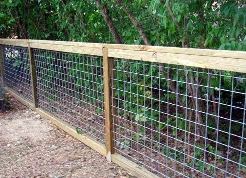 Simple, clean fence using cattle panels.  For the new dog kennel?
