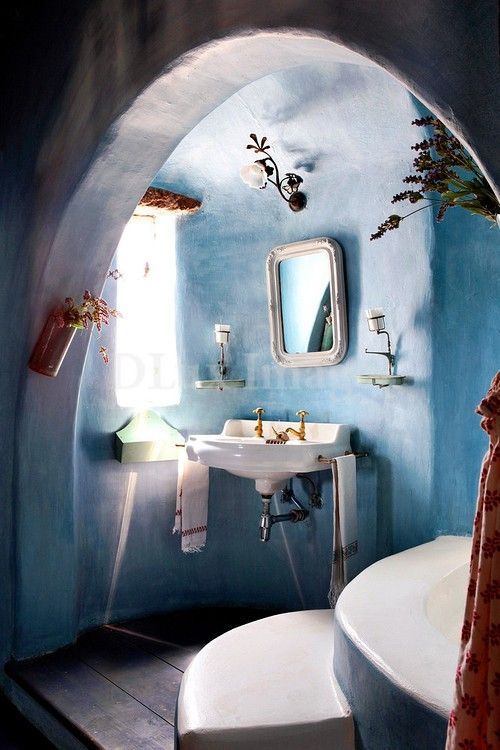 Cob bathroom – love the color and the little jars of herbs (particularly lavender) hanging here and there