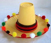 Paper plate, cup, felt and pom-poms to make sombrero for a kid craft! I would only paint plate and cup if