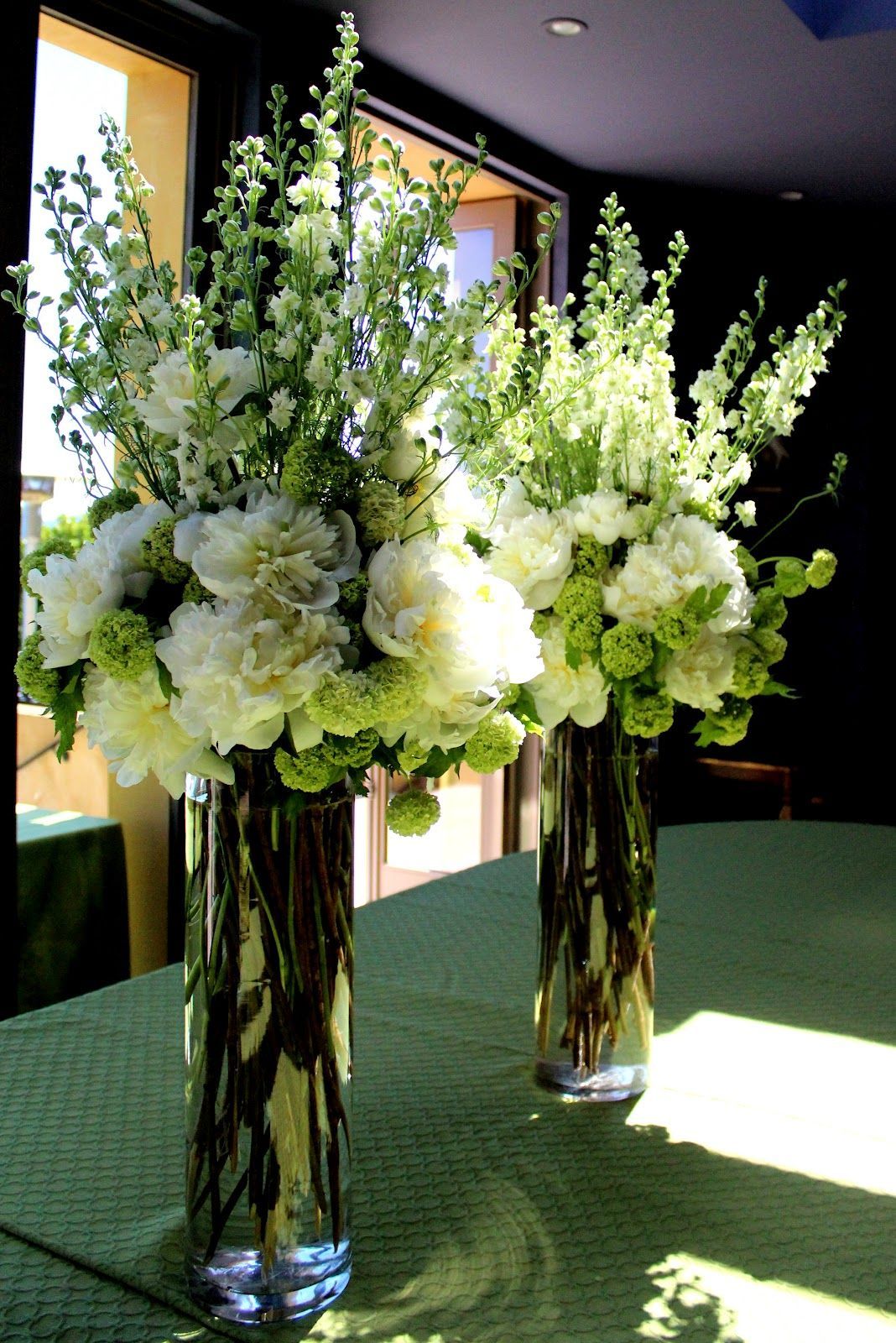 Tall Flower Arrangements For Weddings | The elegant tall centerpieces inside the home had white peonies, g