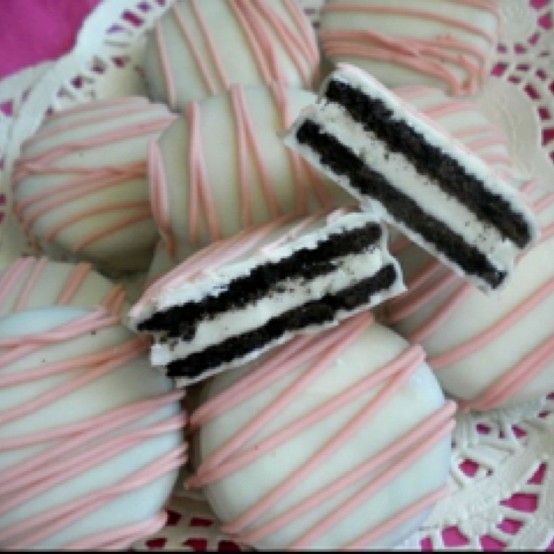 Baby shower cookies. Oreos dipped in melted white chocolate and drizzled with more white chocolate frostin