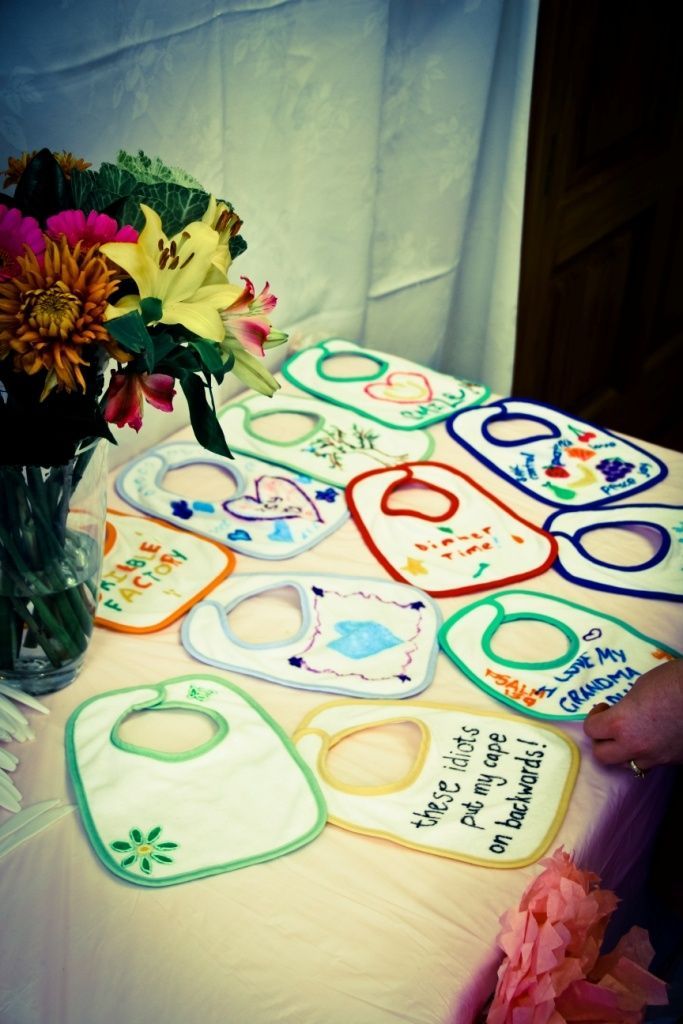 baby shower game: Get fabric pens and each guest personalizes a bib for the baby ( would be better if