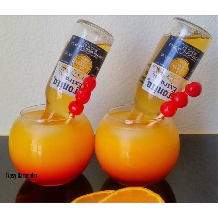 Corona Sunset Cocktail – For more delicious recipes and drinks, visit us here: www.tipsybartende…