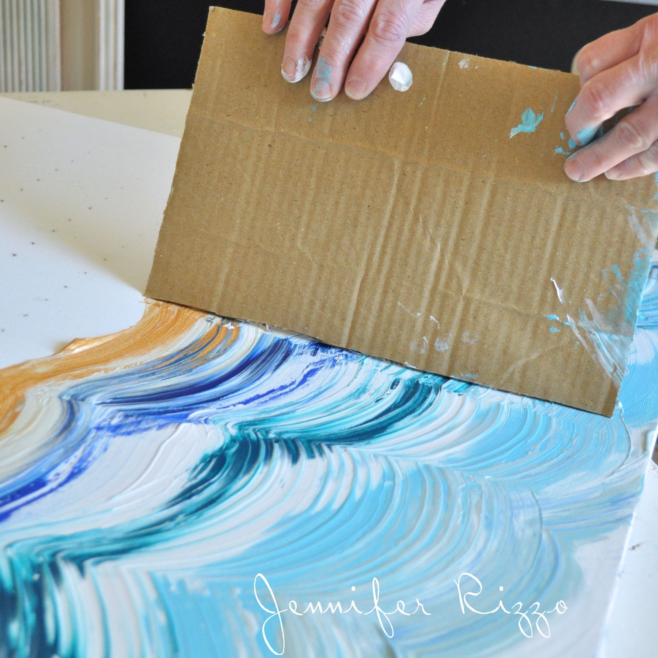 Drag your card board across your paint to make your design- a great way to make a striped or striated patt