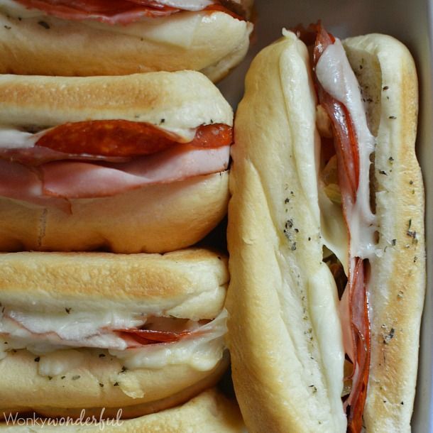 Hot Italian Sandwiches baked in the oven. Meaty Cheesy Sub Sandwiches, great for feeding a large crowd