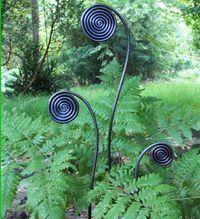 I want to make this for my fern garden! Copper tubing and it would patina nicely.