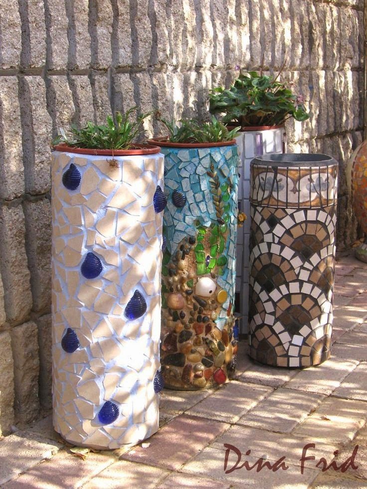 Planters made from plastic PVC tubes and mosaic tiles.