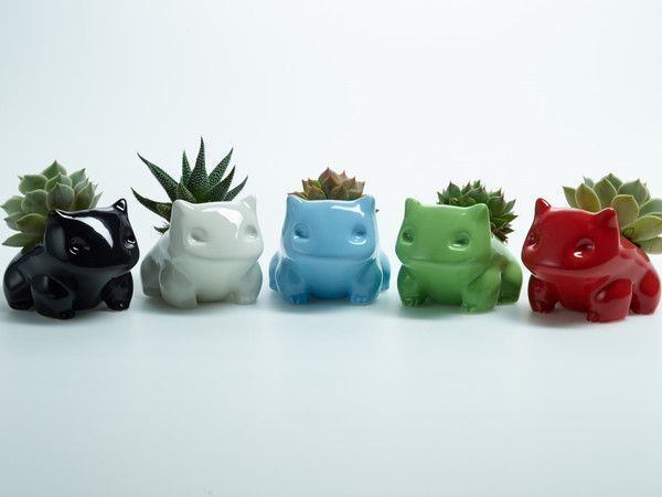 Plastic is 100% non-toxic and has a nice shiny look. Ceramic monsters have a nice heft with a smooth, shin