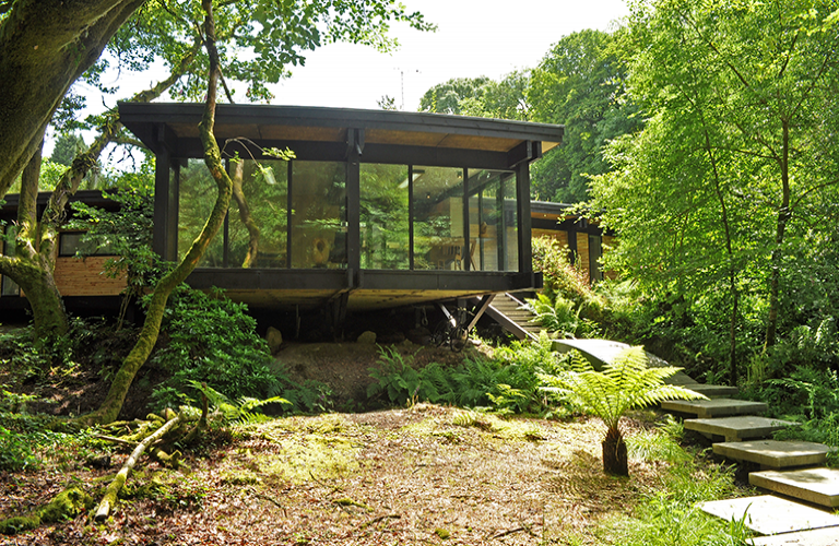Woodland eco house on a budget. I love this house and its setting. Could very happily live in it :)