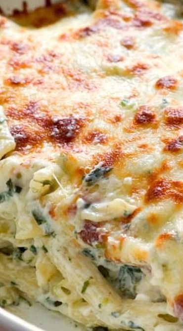 Cheesy Spinach Dip Chicken Pasta – your new favorite dinner! Spinach dip and pasta get together to c