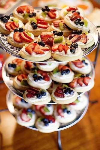 Mini fruit pizzas made on sugar cookies instead of one big crust! Perfect for a party or bridal/baby s