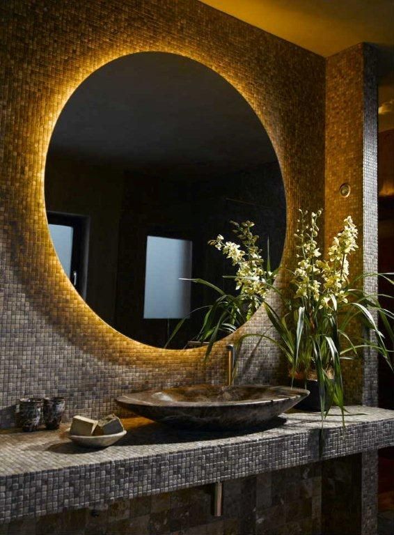 Ultra dark bathroom interior with LED retrofitted oval mirror. Ultra warm white LED Strip (2300-2500K)