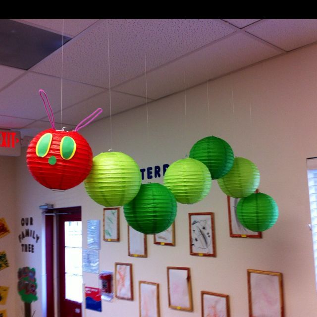 Very Hungry Caterpillar Mobile. Hang 8″ lanterns (1 red, 6 in two shades of green) with different