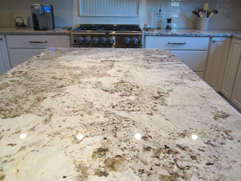 White Alaska Granite – this may be my new favorite countertop material.  Just the right mix of grays,