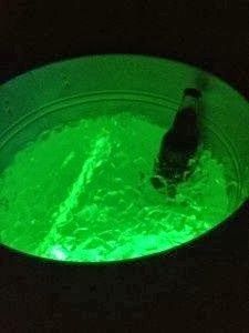Adding a glow stick to serve drinks- great idea for backyard entertaining!