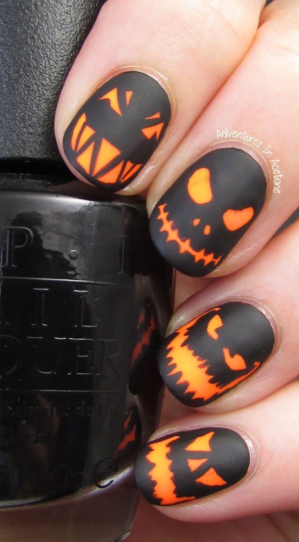 Scary pumpkin head faces Halloween inspired nail art. Add more spook into your Halloween by painting o