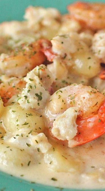 Seafood Gnocchi with White Wine Cream Sauce. Too bad its vegetarian March. Pinning for future ref