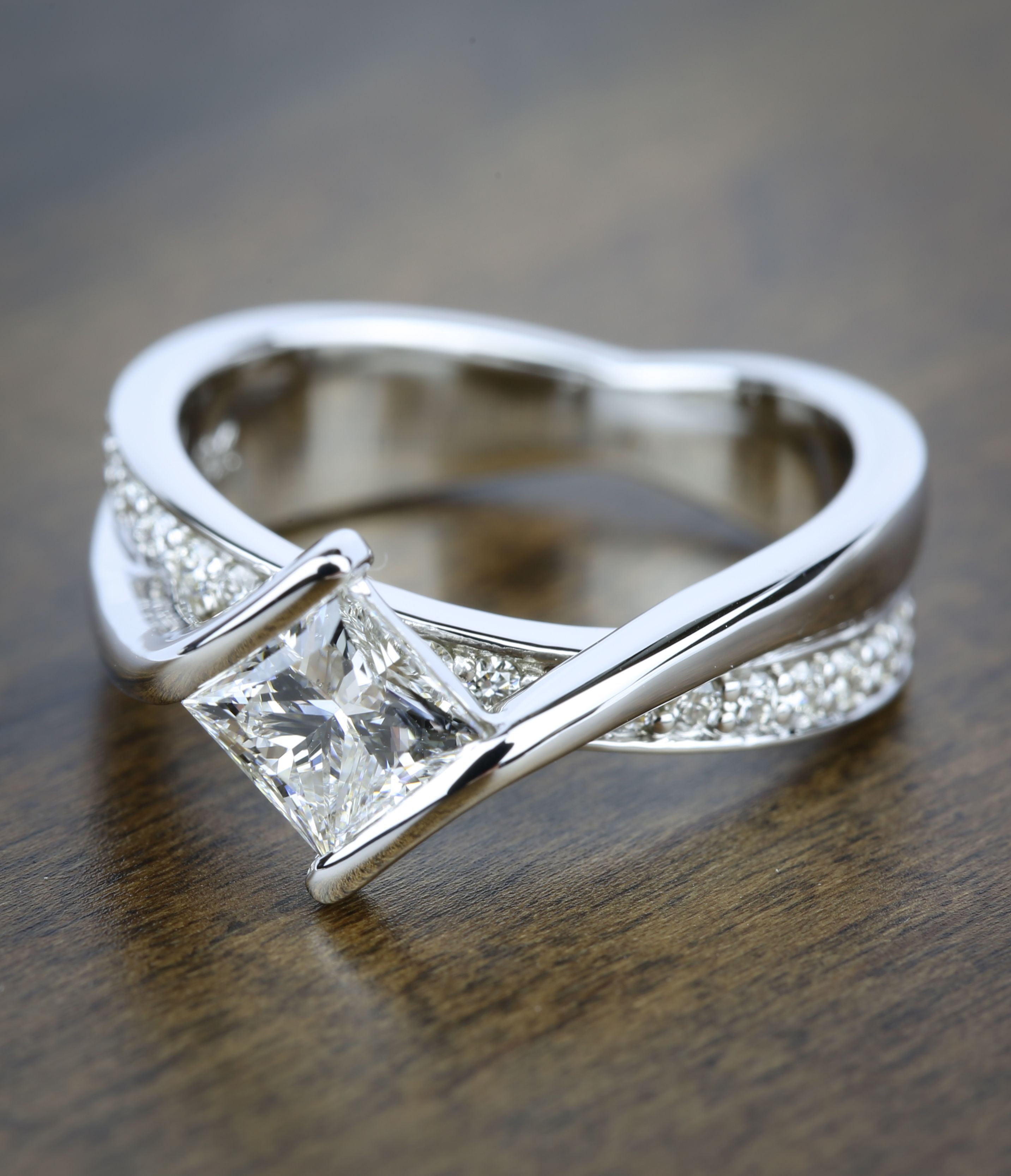 A beautiful Bezel Bridge Princess Cut Diamond Engagement Ring in White Gold! See m