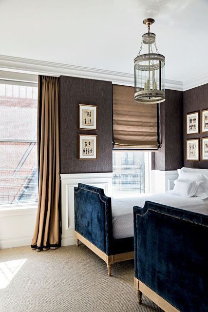 Chic, elegant boys bedroom features a round lantern illuminating upper walls