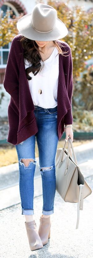 slouchy maroon jacket and a hat.