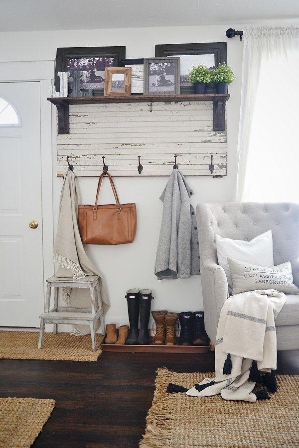 Carve out some space for a (pretty) mudroom with a rustic entryway coat rack and a few storage accessories to complete the nook. |