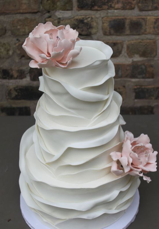 Elegant layer texture white wedding cake topped with pink flowers; Featured Cake: Alliance Bakery