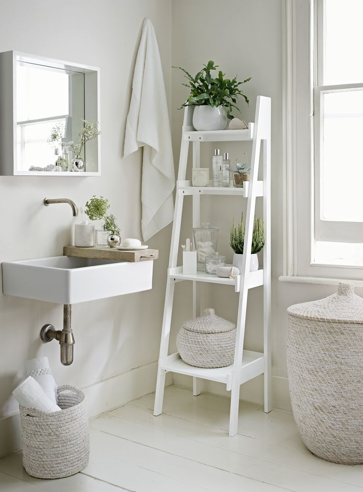 Go with an all-white decorating scheme to make your bathroom feel more spacious. A slim tapering ladder shelf unit, like this from
