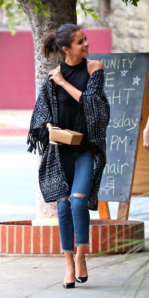 Selena Gomez in a kimono cardigan and distressed jeans.