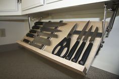 The DropBlock. Store your knifes under the upper cabinets, off the counter tops. Cleaver