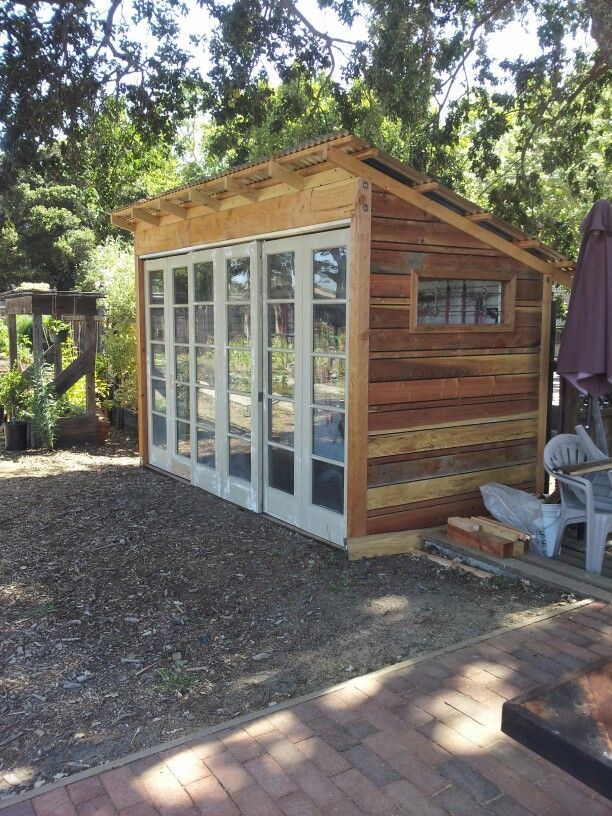 Reclaimed tool shed. Made from old fence boards and recycled French doors.